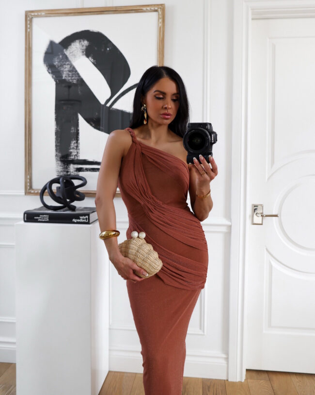 brunette fashion blogger wearing a draped dress from nordstrom